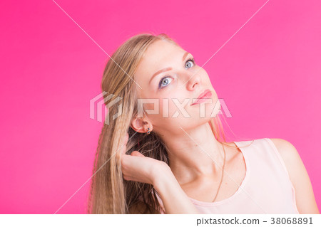 Fashion blonde over pink background. Woman 38068891