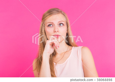 Photo of thoughtful serious female model, tries to 38068898