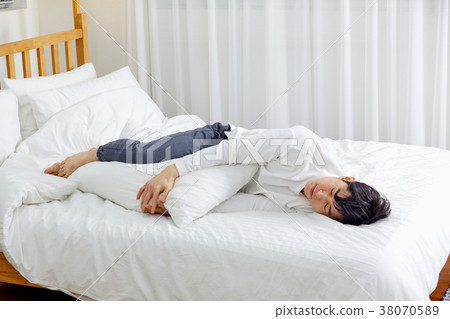 Twenty-year-old man overslept, tired Twenty-year-old man overslept, tired 38070589