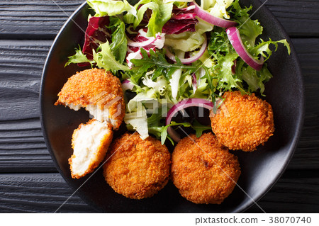 Cod cake in breading with fresh mix salad 38070740