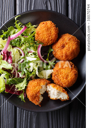 Cod cake in breading with fresh mix salad 38070744