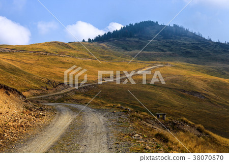 Rural road in mountains 38070870