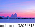 The sun sets behind a little jetty , sunset beach 38071218