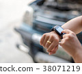 Woman touching hand smart watch, call emergency ca 38071219