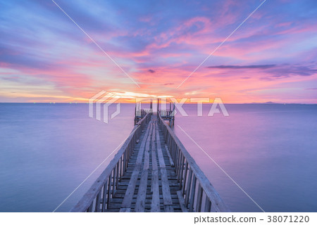 Wooden bridge along sunset sky at beautiful Wooden bridge along sunset sky at beautiful 38071220