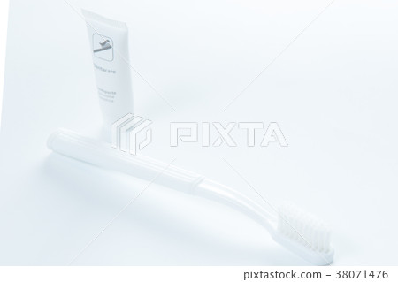 Toothpaste and toothbrush over white Toothpaste and toothbrush over white 38071476