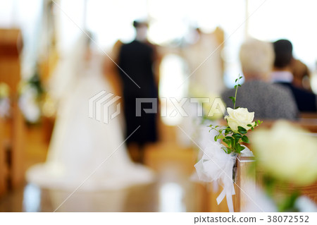Beautiful flower wedding decoration in a church during wedding ceremony Beautiful flower wedding decoration in a church during wedding ceremony 38072552