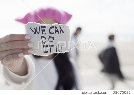woman with a pink hat and the text we can do it woman with a pink hat and the text we can do it 38075021