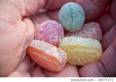closeup of traditional candies in hand 38075371