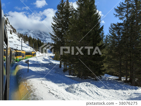 train and snow on road in winter 38076275