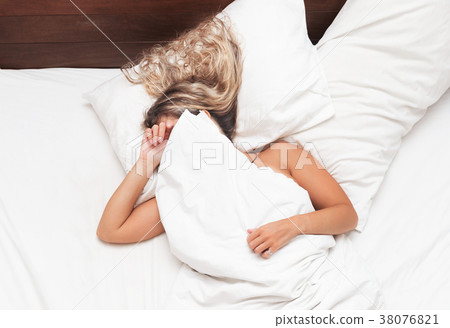 Woman in the bed don't want to wake up morning Woman in the bed don't want to wake up morning 38076821