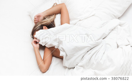 Woman in the bed don't want to wake up morning Woman in the bed don't want to wake up morning 38076822