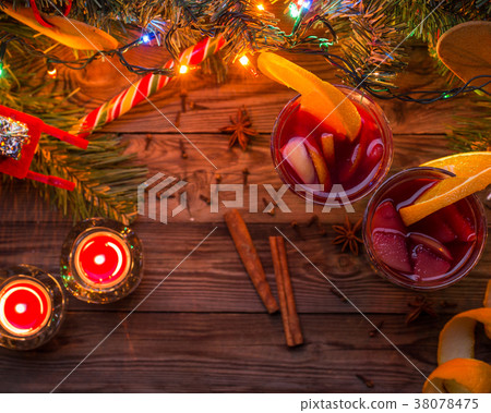 Two glasses of mulled wine with orange slices Two glasses of mulled wine with orange slices 38078475