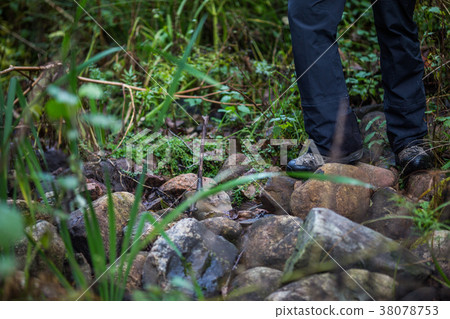 Man hiker legs stand on mountain rock Man hiker legs stand on mountain rock 38078753