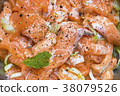 Salmon being prepared for marination 38079526