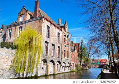 medieval houses and canal in Bruges, Belgium 38079892