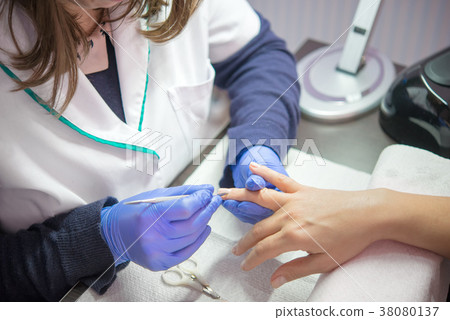 Nail care in salon Nail care in salon 38080137