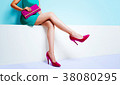Refreshing fashion. Woman in pink bag and shoes in one piece of emerald green 38080295