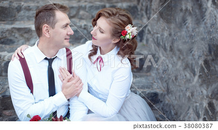 Young happy couple in white shirts having a date 38080387