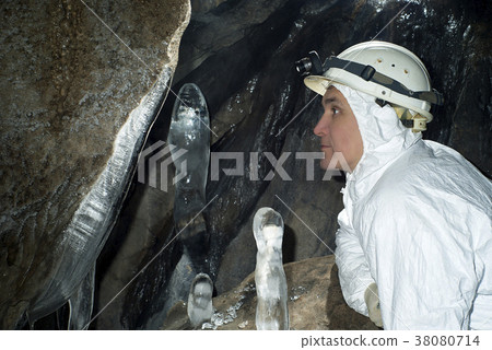 caver in the ice cave caver in the ice cave 38080714