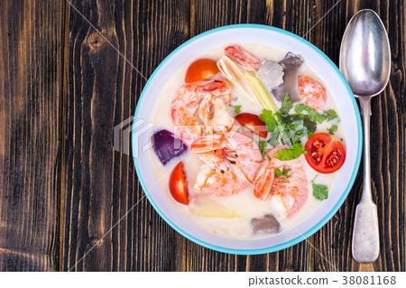 Delicious hot Thai soup Tom Yam with coconut milk 38081168
