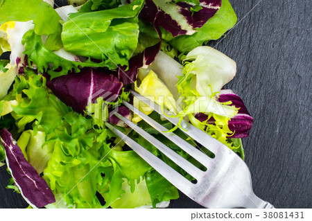 Concept of healthy meal. Fresh leaves of different 38081431