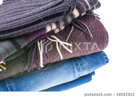 Jeans, pullover, scarf and hat on white background 38082922