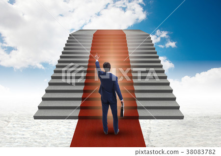 Young businessman climbing stairs and red carpet Young businessman climbing stairs and red carpet 38083782