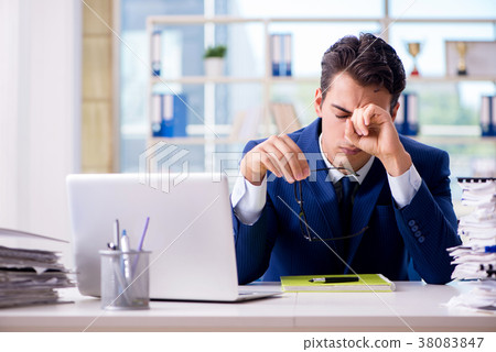 Tired businessman exhausted after hard work and 38083847