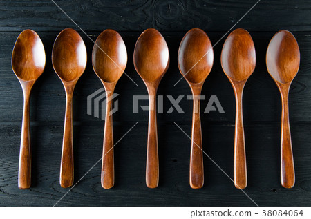 Wooden spoons arranged on table 38084064
