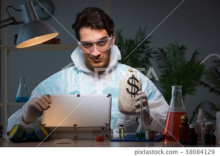 Forensic investigator working in lab looking for 38084129