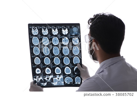Young doctor looking at x-ray images isolated on Young doctor looking at x-ray images isolated on 38085702