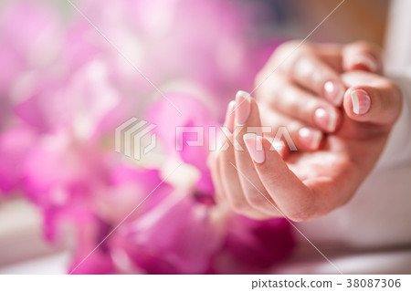 Closeup shot of beautiful female hands with nails. Closeup shot of beautiful female hands with nails. 38087306