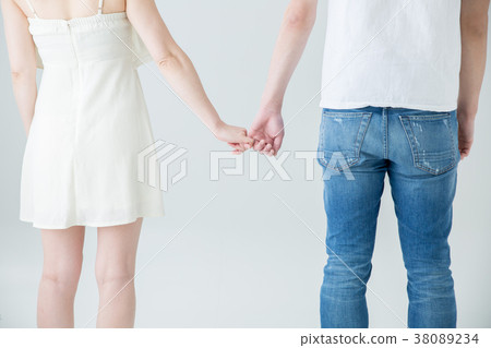 Back view of a couple holding fingers Back view of a couple holding fingers 38089234