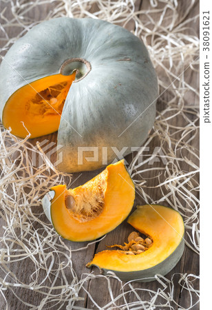Ripe pumpkin on the wooden background 38091621