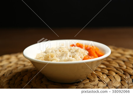 Barley porridge with honey and pieces of pumpkin Barley porridge with honey and pieces of pumpkin 38092066