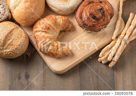 Homemade croissant and bread on old wood 38093076