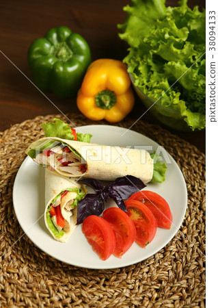 Shawarma, roll with chicken, salad in pita bread 38094133