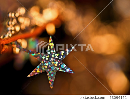 Christmas decoration star and golden sparkling. 38094151