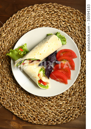 Shawarma, roll with chicken, salad in pita bread Shawarma, roll with chicken, salad in pita bread 38094183