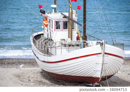 Fishing boat on the beach Fishing boat on the beach 38094713