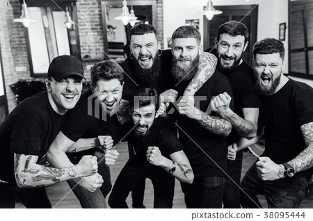 Professional hairstylists in barbershop interior 38095444