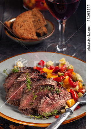 Grilled steak and vegetables. 38095525
