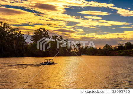 Sunset over Murray river with a boat in Mildur Sunset over Murray river with a boat in Mildur 38095730