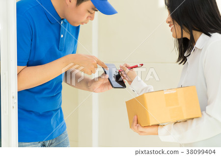 Delivery man pointing on smartphone Delivery man pointing on smartphone 38099404