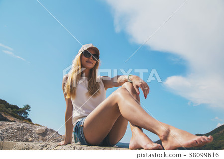 beautiful girl walking along the seashore in the beautiful girl walking along the seashore in the 38099616