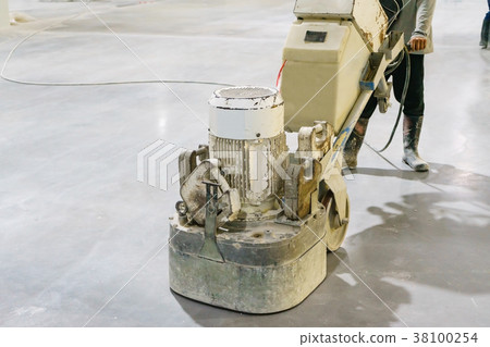 worker using polishing machine for smoothing worker using polishing machine for smoothing 38100254