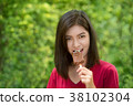 Asian women are eating chocolate ice cream. 38102304