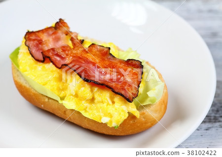 Delicious sandwich with bacon, scrambled egg Delicious sandwich with bacon, scrambled egg 38102422