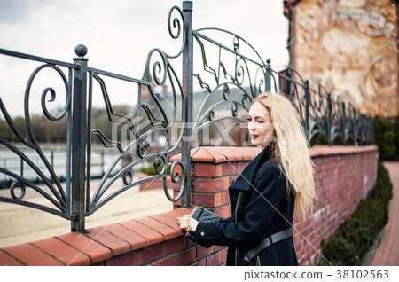 oman with long blond hair on wind oman with long blond hair on wind 38102563